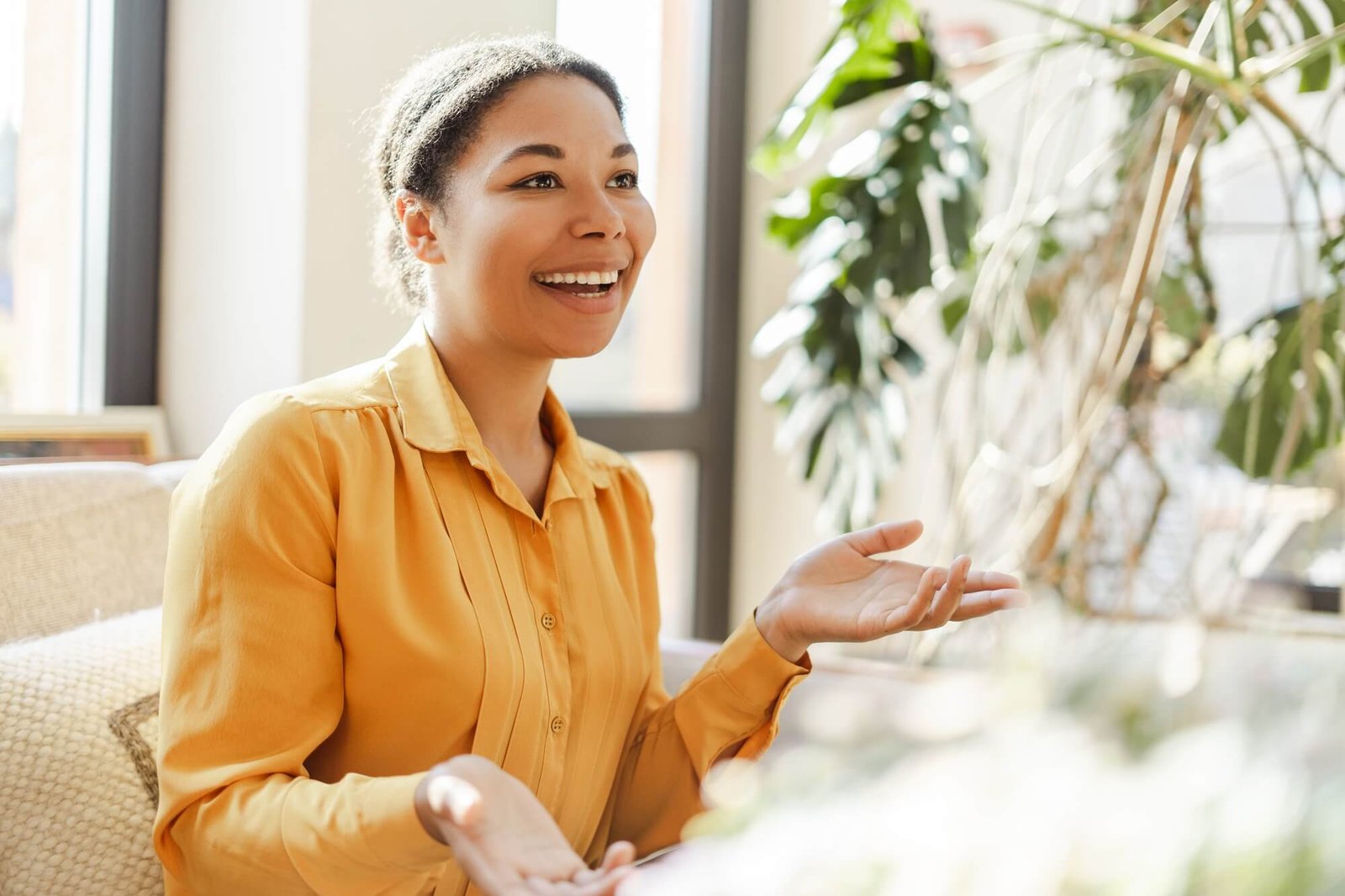 smiling-african-american-woman-learning-and-communicating-in-sign-language.jpg
